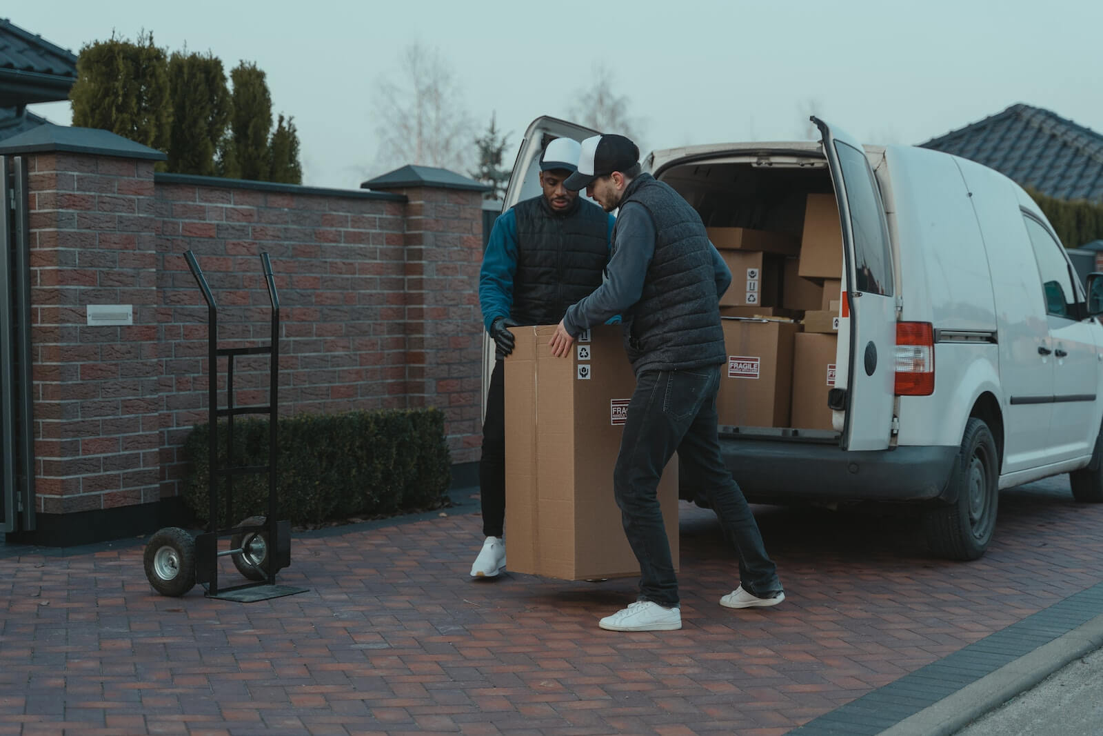 men prepare copier lease return for pickup